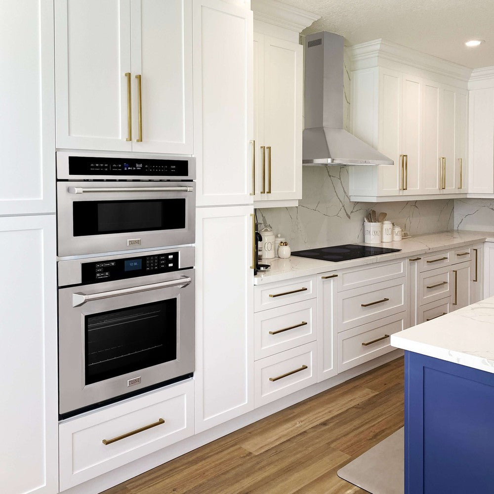 ZLINE Wall Oven, Microwave Oven, and Cooktop in a farmhouse-style kitchen with white cabinets.