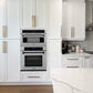 ZLINE Autograph Edition 30 in. 1.6 cu ft. Built-in Convection Microwave Oven in Satin Stainless Steel and Matte Black Accents (MWOZ-30-SS-MB) in a luxury kitchen with white cabinets, stainless steel appliances, and marble countertop.