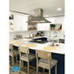 Proline Island Mount Ducted Range Hood in Stainless Steel (PLFI 520) in a kitchen with white countertops, white cabinets, and wooden chairs.