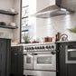 ZLINE 48 in. 6.0 cu. ft. Legacy Dual Fuel Range with Gas Cooktop and 2 Electric Ovens in Stainless Steel with 6 Brass Burners (RA-BR-48) in a luxury modern-style kitchen from below.