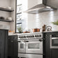 ZLINE 48 in. 6.0 cu. ft. Legacy Dual Fuel Range with Gas Cooktop and 2 Electric Ovens in Stainless Steel with 6 Brass Burners (RA-BR-48) in a luxury modern-style kitchen from below.