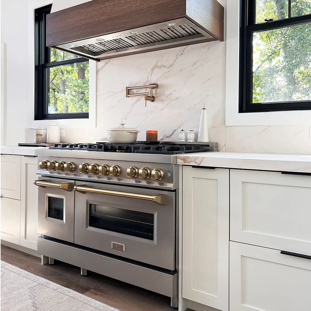 Farmhouse kitchen with a ZLINE Autograph Edition 48 in. 6.0 cu. ft. Legacy Dual Fuel Range with 7 Burner Gas Cooktop and 2 Electric Ovens in Stainless Steel and Champagne Bronze Accents (RAZ-48-CB) and marble countertop
