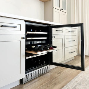 ZLINE 24 in. Monument Dual Zone 44-Bottle Wine Cooler in Stainless Steel (RWV-UD-24) integrated into a kitchen cabinet with white cabinets and a wooden floor.