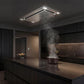 A modern kitchen interior with dark wood cabinetry, a central island, and a VICTORY Sunset Flush Ceiling Mount Range Hood. Steam rises from a pot on the island countertop.