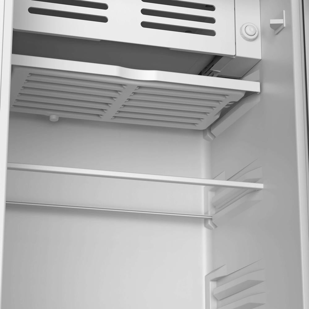 Interior of a TCL 18 in. 3.1 Cu. Ft. Compact Single Door Mini Fridge in Silver (TRM31S4AV) with shelves and a ventilation system.