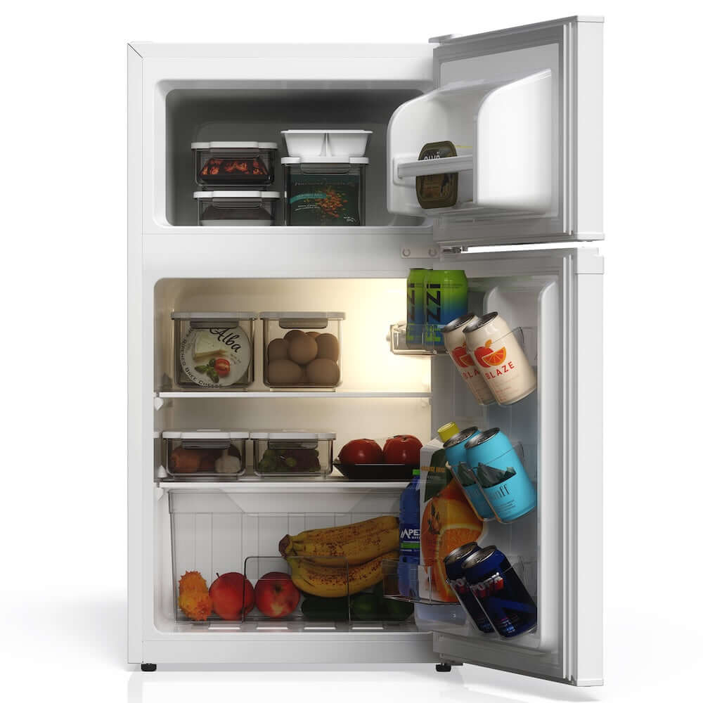 TCL 18 in. 3.1 Cu. Ft. Compact Top Freezer Mini Fridge in White (TRM31D4AW) with open door showing food and drinks on a white background