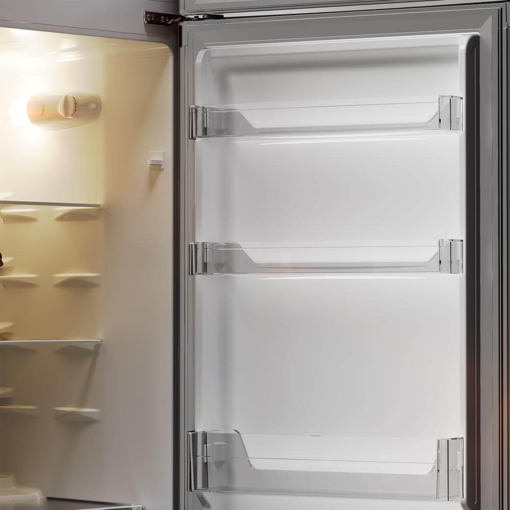 Open TCL 22 in. 7.3 Cu. Ft. Compact Top Freezer Refrigerator in Silver (TRT07T4AL) with glass shelves and a light interior.