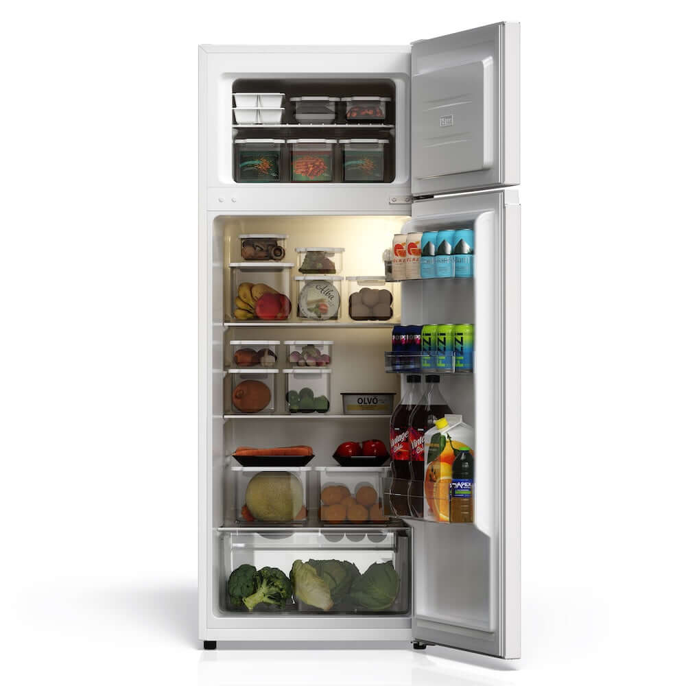 Open TCL 22 in. 7.3 Cu. Ft. Compact Top Freezer Refrigerator in White (TRT07T4AW) with various food items on a white background