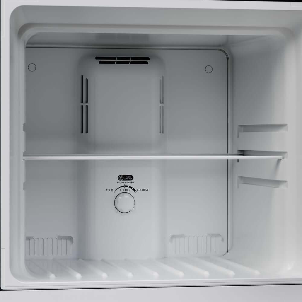 Empty refrigerator freezer compartment with temperature control panel.