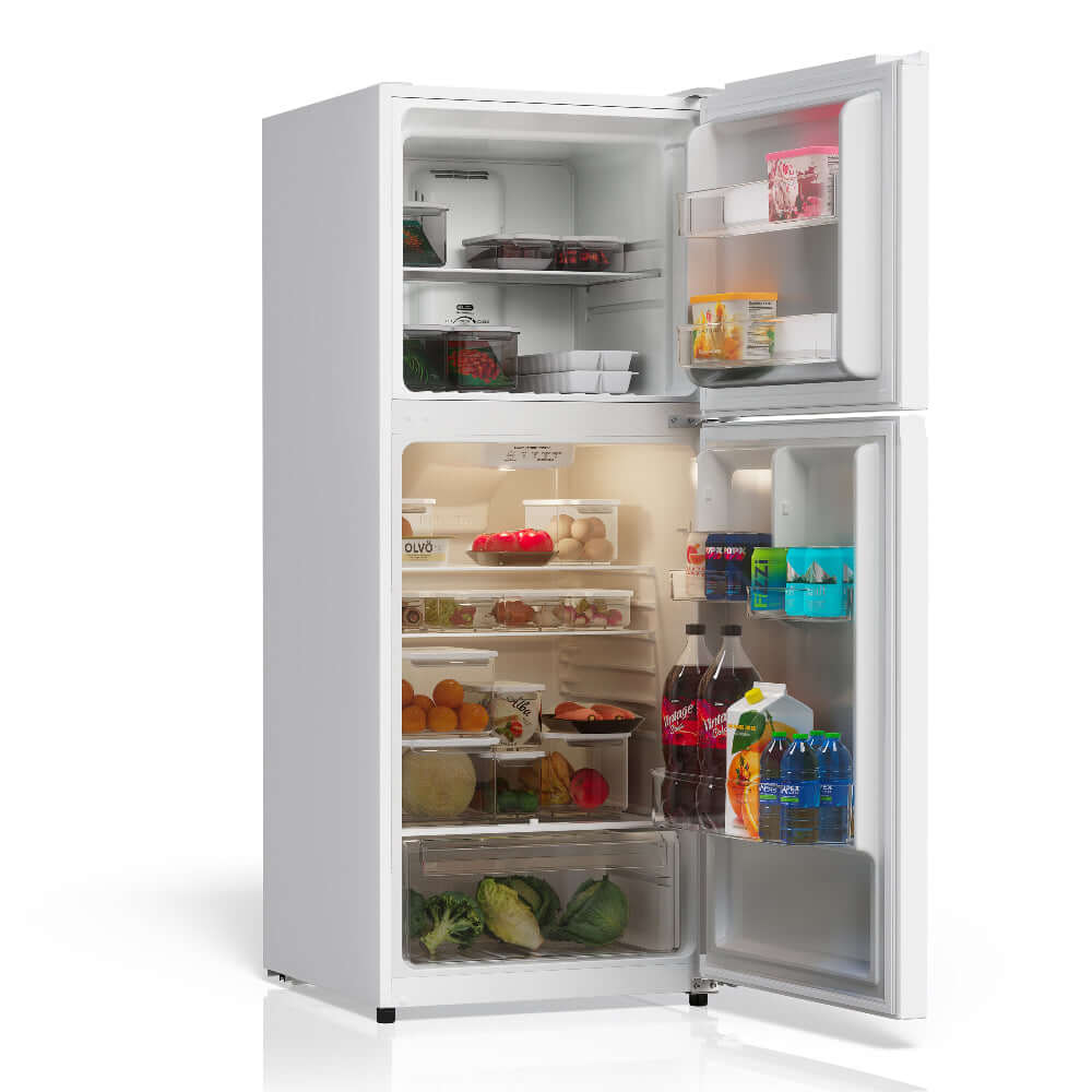 TCL 24 in. 10.1 Cu. Ft. Top Freezer Refrigerator in White (TRT10T4AW) with open doors displaying various food items and drinks on a white background