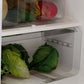 Open refrigerator door showing fresh produce inside