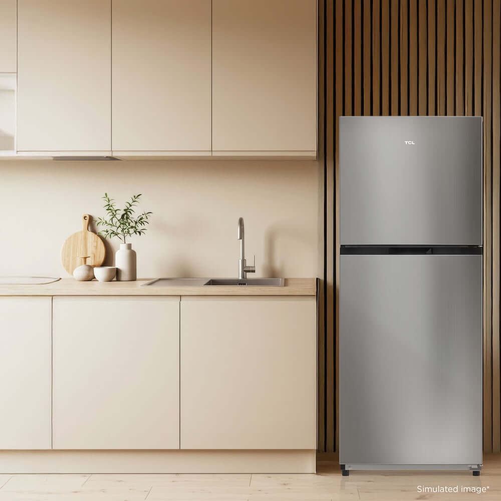 TCL 24 in. 11.6 Cu. Ft. Top Freezer Counter-Depth Refrigerator in Silver (TRT12T4AL) in a modern kitchen.