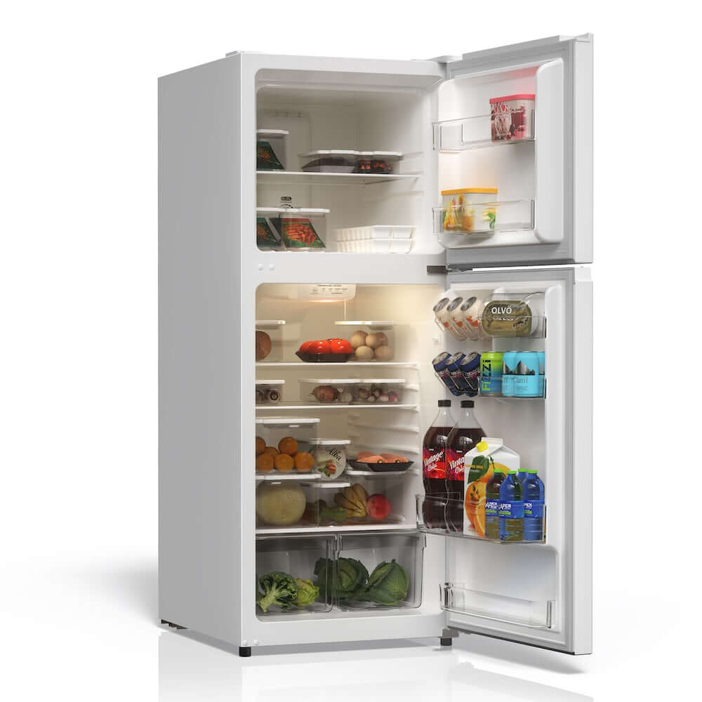 Open TCL 24 in. 11.6 Cu. Ft. Top Freezer Counter-Depth Refrigerator in White (TRT12T4AW) with food items on a white background