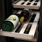 Wine bottles in a wooden wine rack inside TCL 24 in. 20 Bottle 78 Can Dual Zone Wine Cooler with Glass Doors (TRD20B8AS)