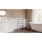 Bathroom with white vanity, Kingston Brass Templeton Freestanding/Wall Mount Hardwired or Plug-In Towel Warmer Brushed Nickel, freestanding bathtub, and window with gold frame.