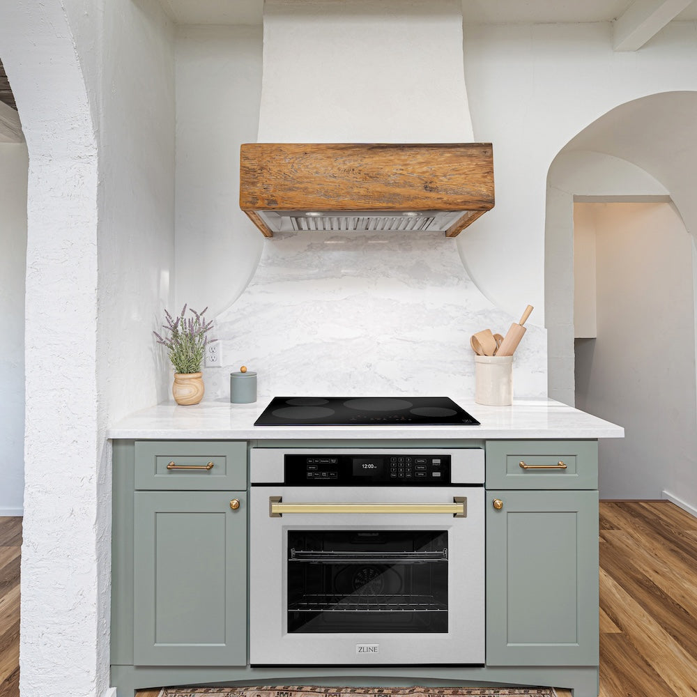 ZLINE Autograph Edition 30 in. Professional True Convection Single Wall Oven with Air Fry and Self Clean in DuraSnow® Stainless Steel with Polished Gold Handle (WASSZ-30-G) in a rustic kitchen below induction cooktop.