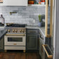 ZLINE Autograph Edition 30 in. 4.0 cu. ft. Legacy Dual Fuel Range with 4 Burner Gas Cooktop and Electric Convection Oven in Stainless Steel with White Matte Door and Champagne Bronze Accents (RAZ-WM-30-CB) in a kitchen with matching stainless steel appliances and gray tiled backsplash