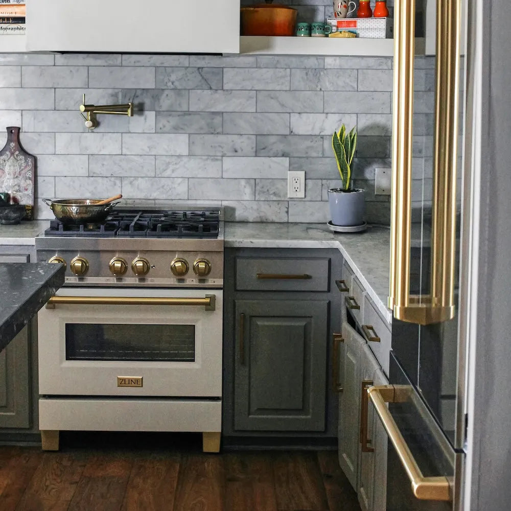 ZLINE Autograph Edition 30 in. 4.0 cu. ft. Legacy Dual Fuel Range with 4 Burner Gas Cooktop and Electric Convection Oven in Stainless Steel with White Matte Door and Champagne Bronze Accents (RAZ-WM-30-CB) in a kitchen with matching stainless steel appliances and gray tiled backsplash