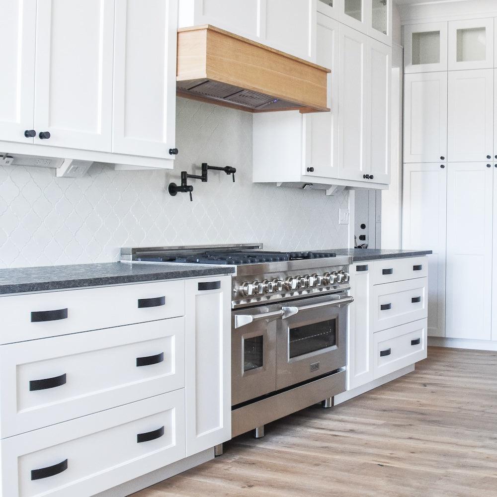 ZLINE Ducted Wall Mount Range Hood Insert in Stainless Steel (695) in a cottage-style range hood, side.