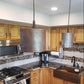 Premier Copper 8 in. Hammered Copper Oval Cylinder Pendant Light