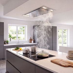 A modern kitchen island with a VICTORY Horizon 42 in. 900 CFM Flush Ceiling Mount Range Hood in Stainless Steel. The kitchen features gray cabinetry, a white countertop, cooking pots, stacked plates, and a wooden cutting board.
