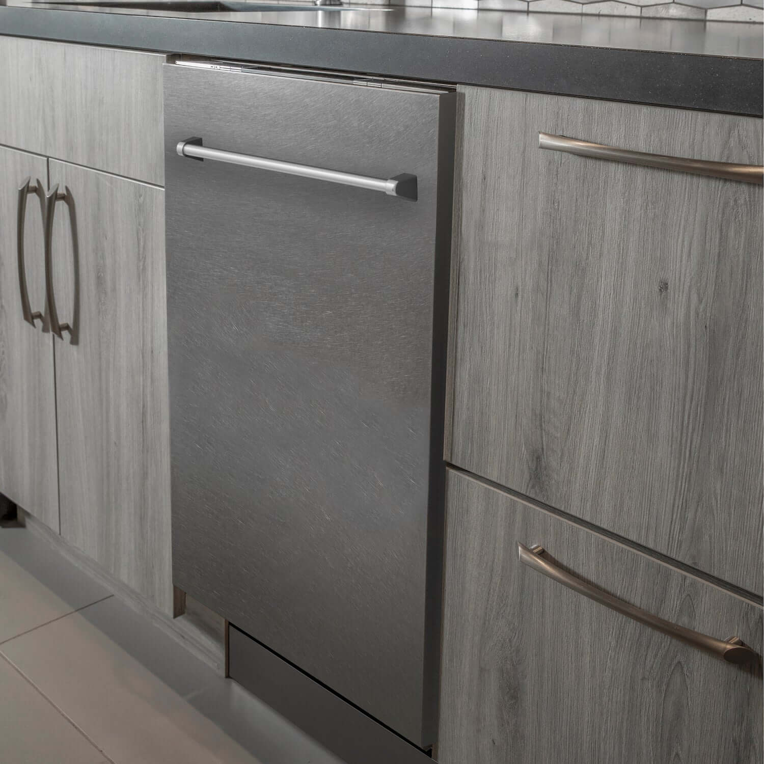 ZLINE 24 in. Fingerprint Resistant Top Control Built-In Dishwasher with Stainless Steel Tub and Traditional Style Handle, 52dBa (DW-SN-H-24) built-in to cabinets in a luxury kitchen.