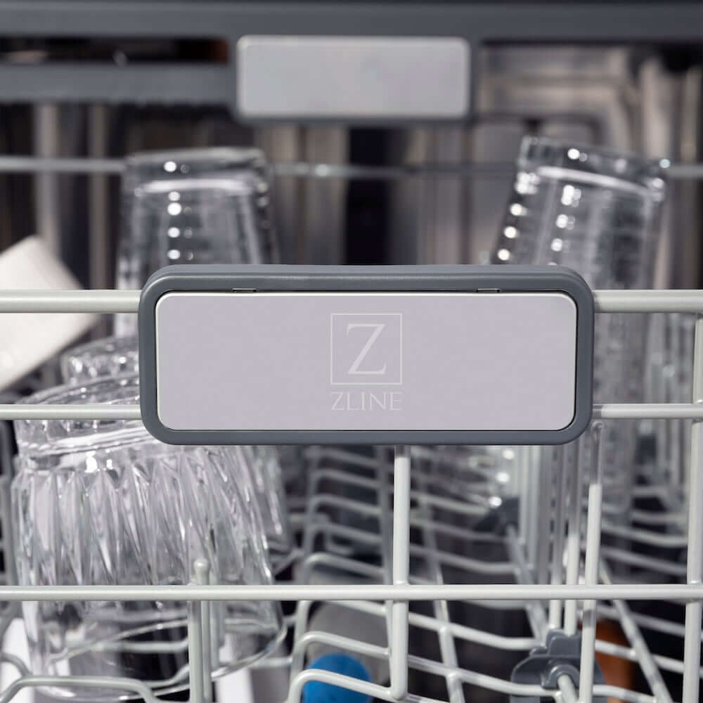 ZLINE Autograph Edition 24 in. Monument Series 3rd Rack Top Touch Control Tall Tub Dishwasher in Black Matte with Polished Gold Handle, 45dBa (DWMTZ-BLM-24-G) ZLINE logo on dish rack.