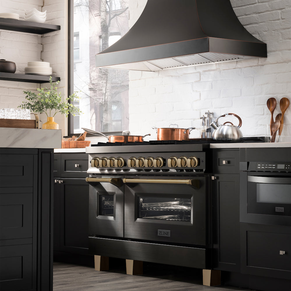 ZLINE Autograph Edition 48 in. 6.0 cu. ft. Dual Fuel Range with Gas Stove and Electric Oven in Black Stainless Steel with Champagne Bronze Accents (RABZ-48-CB) from side in a luxury farmhouse-style kitchen.