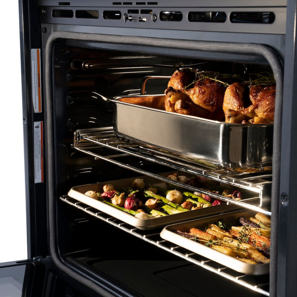 ZLINE Autograph Edition 30 in. Professional True Convection Double Wall Oven with Air Fry and Self Clean in Black Stainless Steel with Champagne Bronze Handles (WADBZ-30-CB) close-up, food cooking inside oven.