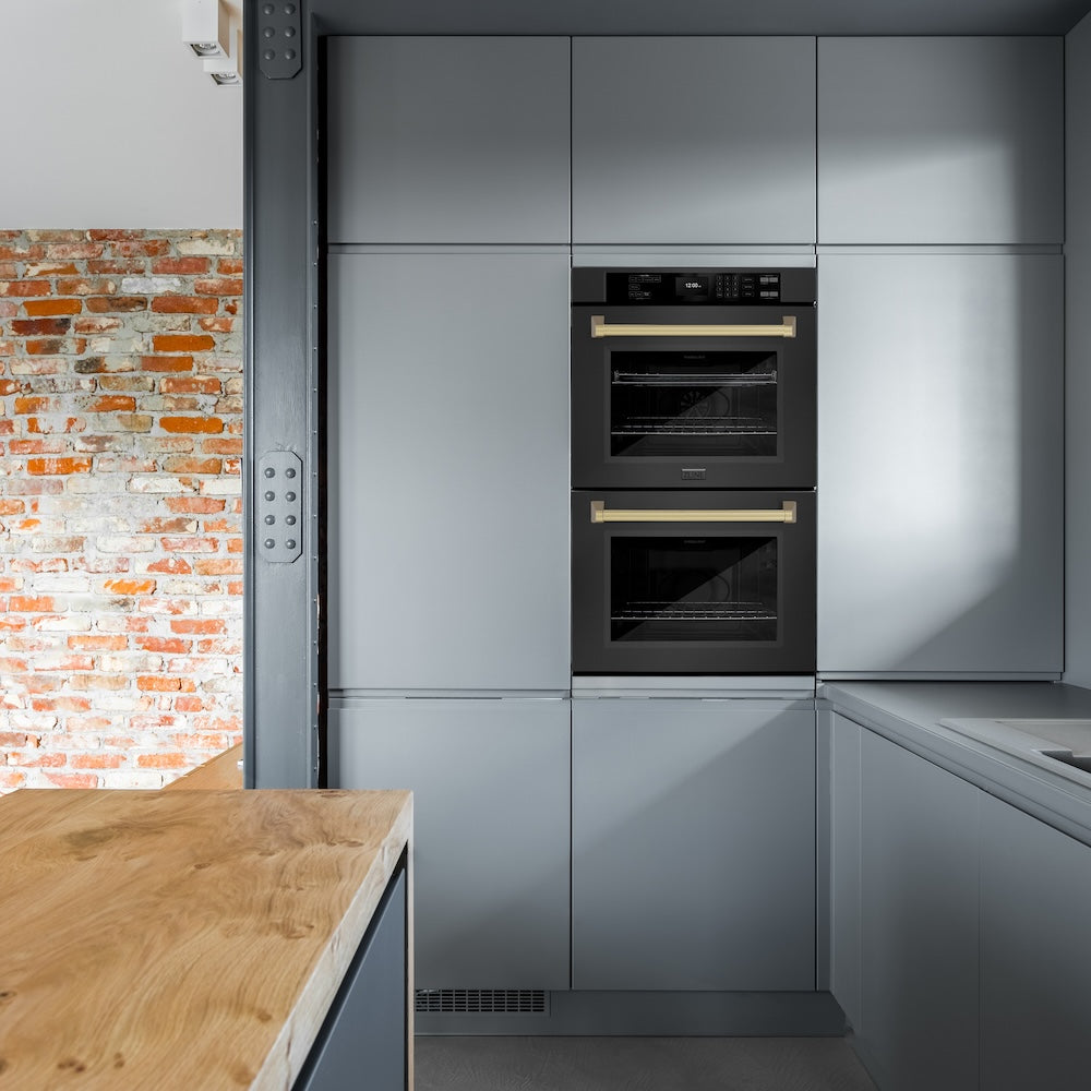 ZLINE Autograph Edition 30 in. Professional True Convection Double Wall Oven with Air Fry and Self Clean in Black Stainless Steel with Champagne Bronze Handles (WADBZ-30-CB) in a modern-style kitchen with blue walls.