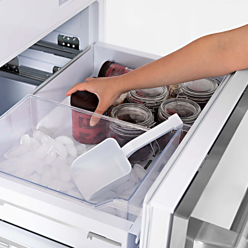 Frozen food inside bottom freezer compartment of ZLINE built-in refrigerator.