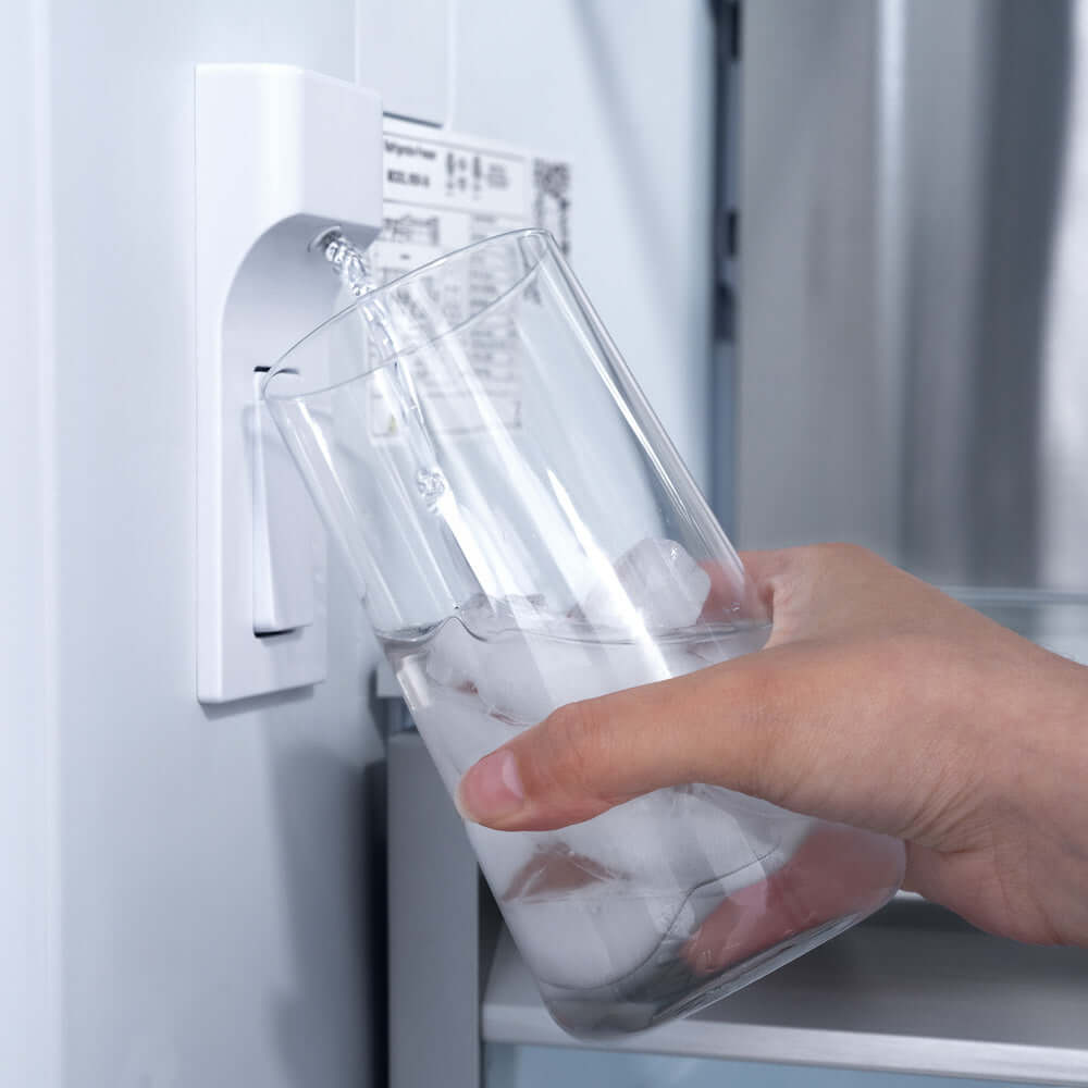 Using the built-in water dispenser inside ZLINE Built-in Panel Ready Refrigerator close up.