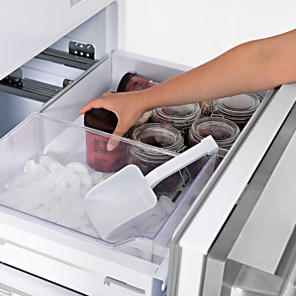 ZLINE Autograph Edition 30 in. 16.1 cu. ft. Built-In Bottom Freezer Refrigerator with Water Dispenser and Ice Maker in Satin Stainless Steel with Champagne Bronze Accents (RBIVZ-SN-30-CB) bottom freezer open filled with frozen food items.