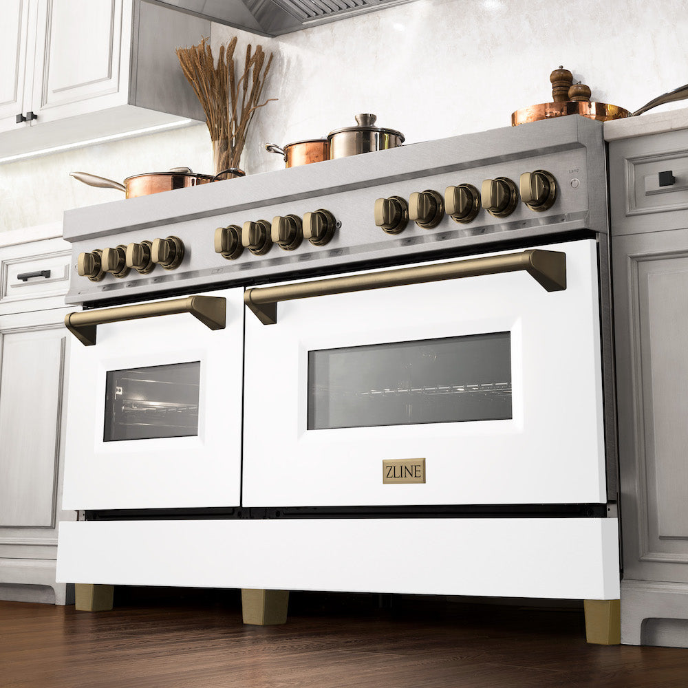 ZLINE Autograph Edition 60 in. 7.4 cu. ft. Dual Fuel Range with Gas Stove and Electric Oven in Fingerprint Resistant Stainless Steel with White Matte Door and Champagne Bronze Accents (RASZ-WM-60-CB) from below in a luxury kitchen with cookware on cooktop.