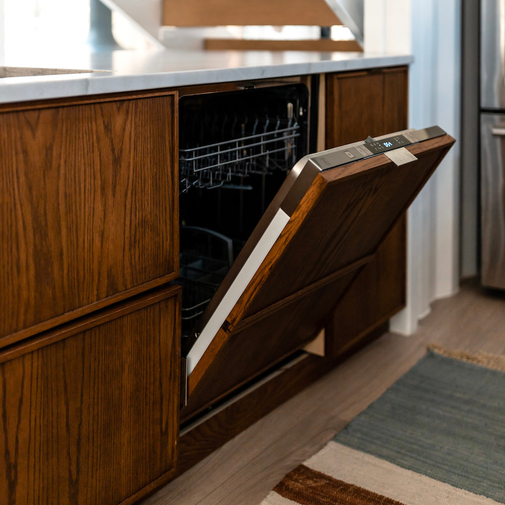 ZLINE Tallac Dishwasher with custom wood-grain panel in a luxury kitchen close up with door half open.