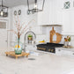 ZLINE Autograph Edition 36 in. Legacy Gas Rangetop with 6 Burners and Porcelain Cooktop in Black Stainless Steel with Champagne Bronze Accents (RTBZ-36-CB) in a luxury cottage-style kitchen from side.