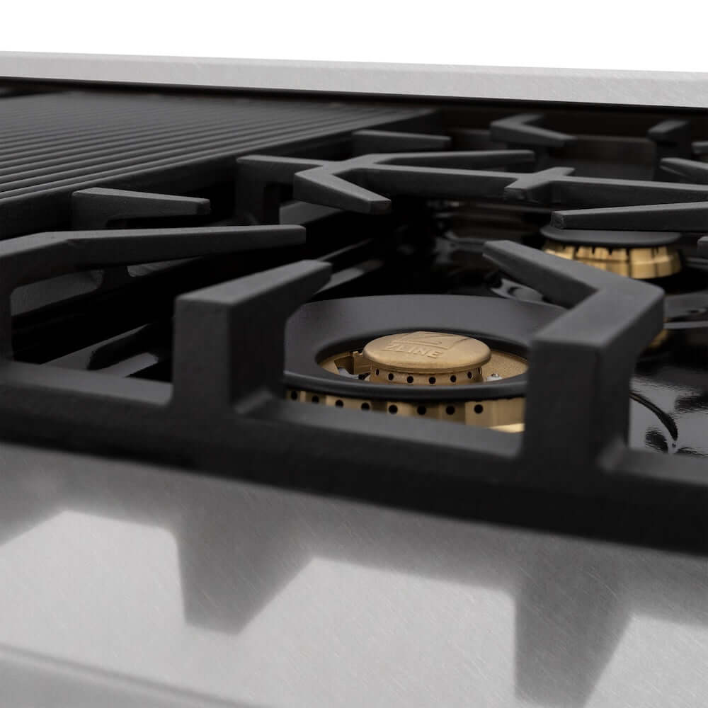 ZLINE brass burners and cast-iron grates from front low on Autograph Edition range.