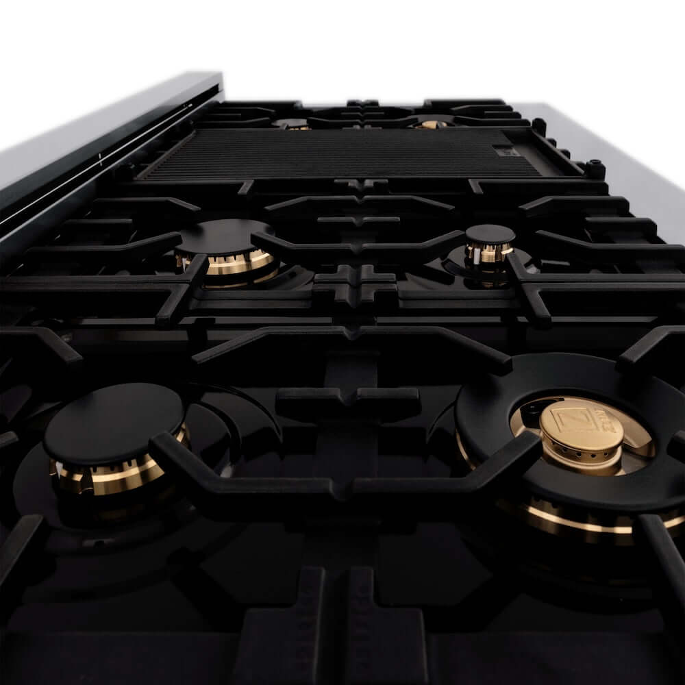 ZLINE brass burners, griddle, and cast iron grates on black porcelain cooktop of 48-inch range from side.