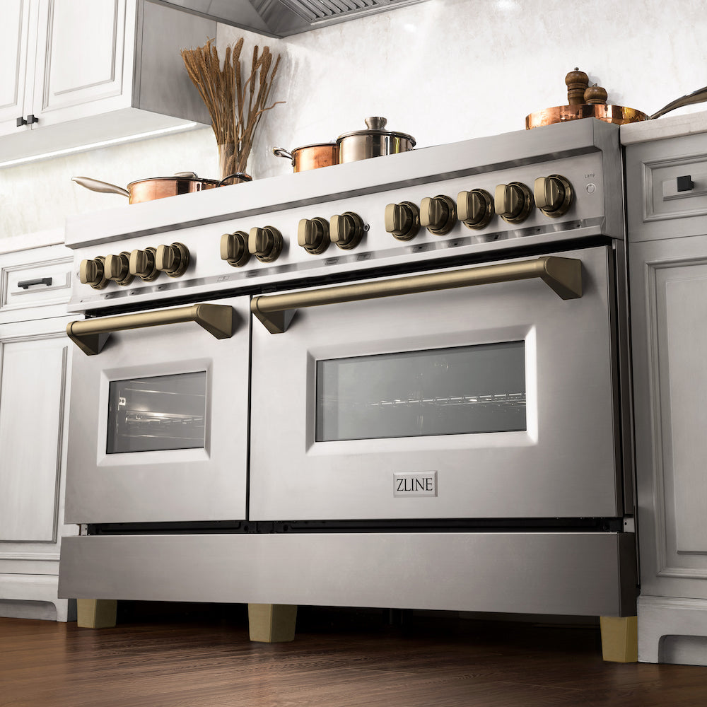 ZLINE Autograph Edition 60 in. 7.4 cu. ft. Dual Fuel Range with Gas Stove and Electric Oven in Stainless Steel with Champagne Bronze Accents (RAZ-60-CB) from below in a luxury kitchen with cookware on cooktop.