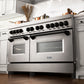 ZLINE Autograph Edition 60 in. 7.4 cu. ft. Legacy Dual Fuel Range with 9 Burner Gas Cooktop and 2 Electric Convection Ovens in Stainless Steel and Matte Black Accents (RAZ-60-MB) in a luxury kitchen.