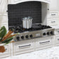 ZLINE Autograph Edition 48 in. Legacy Gas Rangetop with 7 Burners and Porcelain Cooktop in Stainless Steel with Matte Black Accents (RTZ-48-MB) in a kitchen with black tiled backsplash and white cabinets.