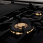 ZLINE Autograph Edition 60 in. 7.4 cu. ft. Legacy Dual Fuel Range with 9 Burner Gas Cooktop and 2 Electric Convection Ovens in Stainless Steel with White Matte Doors and Matte Black Accents (RAZ-WM-60-MB) detail, brass burners on gas cooktop.