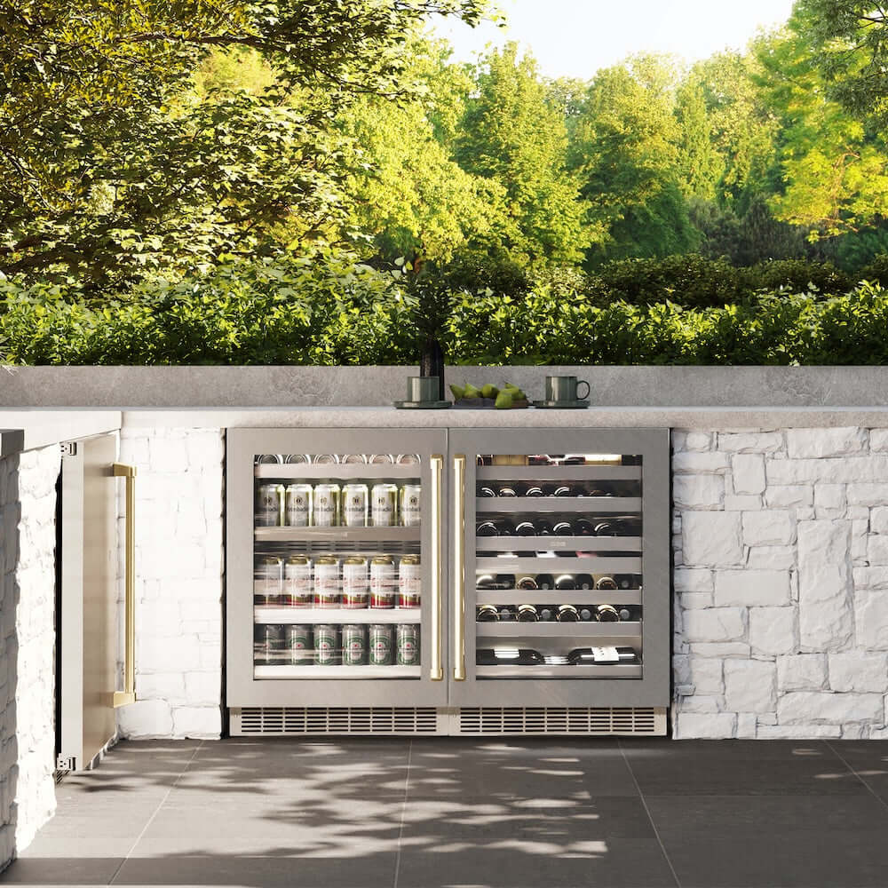 ZLINE Autograph Edition 24 in. Touchstone Dual Zone 44 Bottle Wine Cooler With DuraSnow® Stainless Steel Glass Door And Champagne Bronze Handle (RWDOZ-SN-24-CB) in a luxury outdoor kitchen, front.