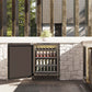 ZLINE Autograph Edition 24 in. Touchstone 151 Can Beverage Fridge With Solid Stainless Steel Door And Champagne Bronze Handle (RBSOZ-ST-24-CB) front, open, in an outdoor patio area with a matching wine cooler against a stone wall and greenery.