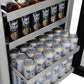 ZLINE Autograph Edition 24 in. Touchstone 151 Can Beverage Fridge with Solid Stainless Steel Door and Polished Nickel Helix Handle (RBSOZ-ST-24-KPN) open, showing shelves with cans of 'Modelo' Beer and 'Liquid Death' Water.