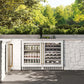 ZLINE Autograph Edition 24 in. Touchstone 151 Can Beverage Fridge With White Matte Glass Door And Polished Gold Handle (RBSOZ-WM-24-G) front, in an outdoor patio area with a matching wine cooler against a stone wall and greenery.