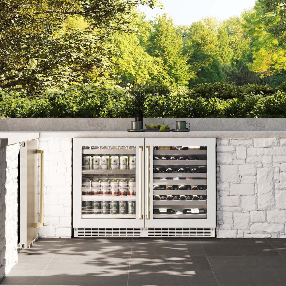 ZLINE Autograph Edition 24 in. Touchstone Dual Zone 44 Bottle Wine Cooler With White Matte Glass Door And Champagne Bronze Handle (RWDOZ-WM-24-CB) in a luxury outdoor kitchen, front.