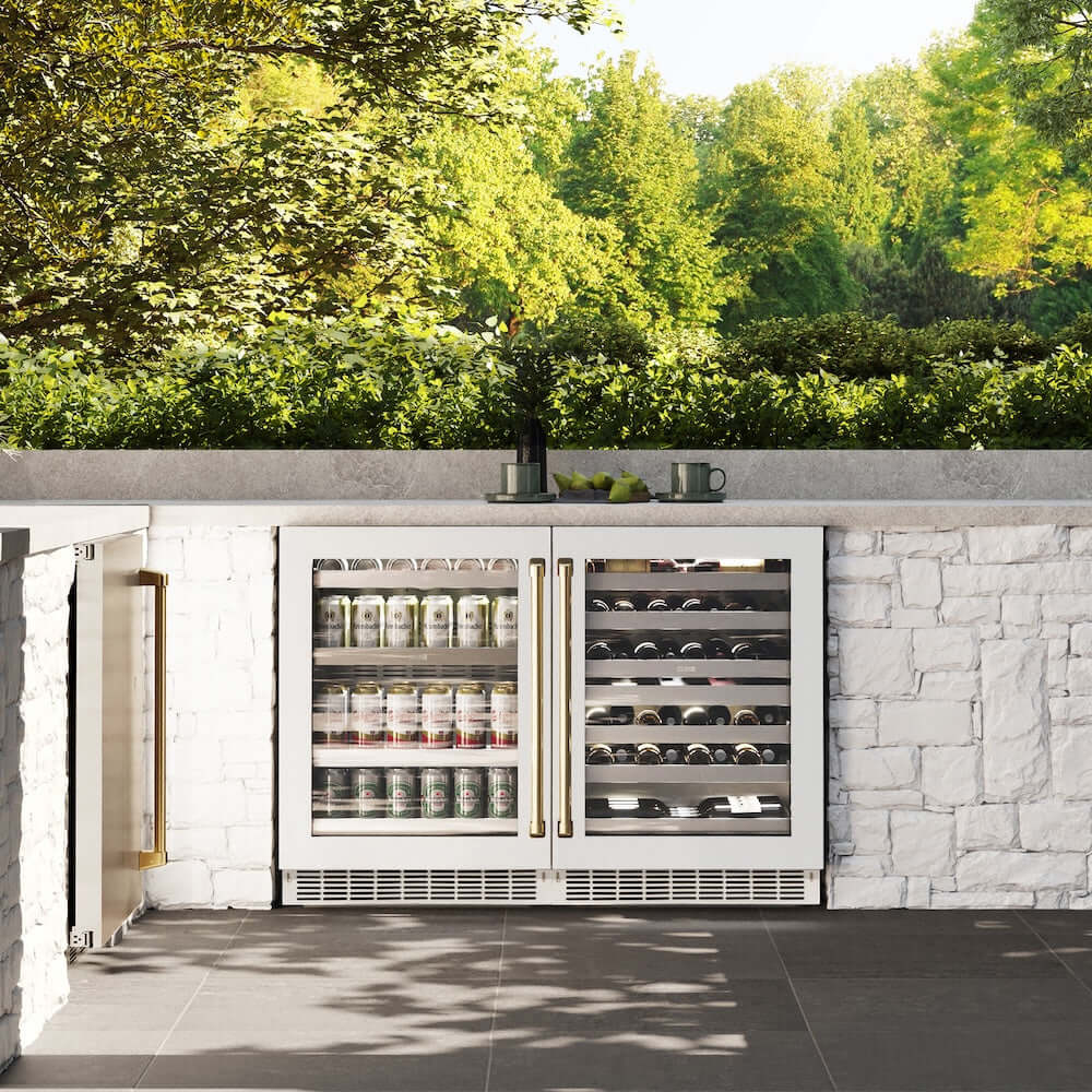 ZLINE Autograph Edition 24 in. Touchstone Dual Zone 44 Bottle Wine Cooler With White Matte Glass Door And Polished Gold Handle (RWDOZ-WM-24-G) in a luxury outdoor kitchen, front.