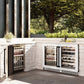 ZLINE Autograph Edition 24 in. Touchstone Dual Zone 44 Bottle Wine Cooler With White Matte Glass Door And Matte Black Handle (RWDOZ-WM-24-MB) side, in an outdoor patio area against a stone wall and greenery.