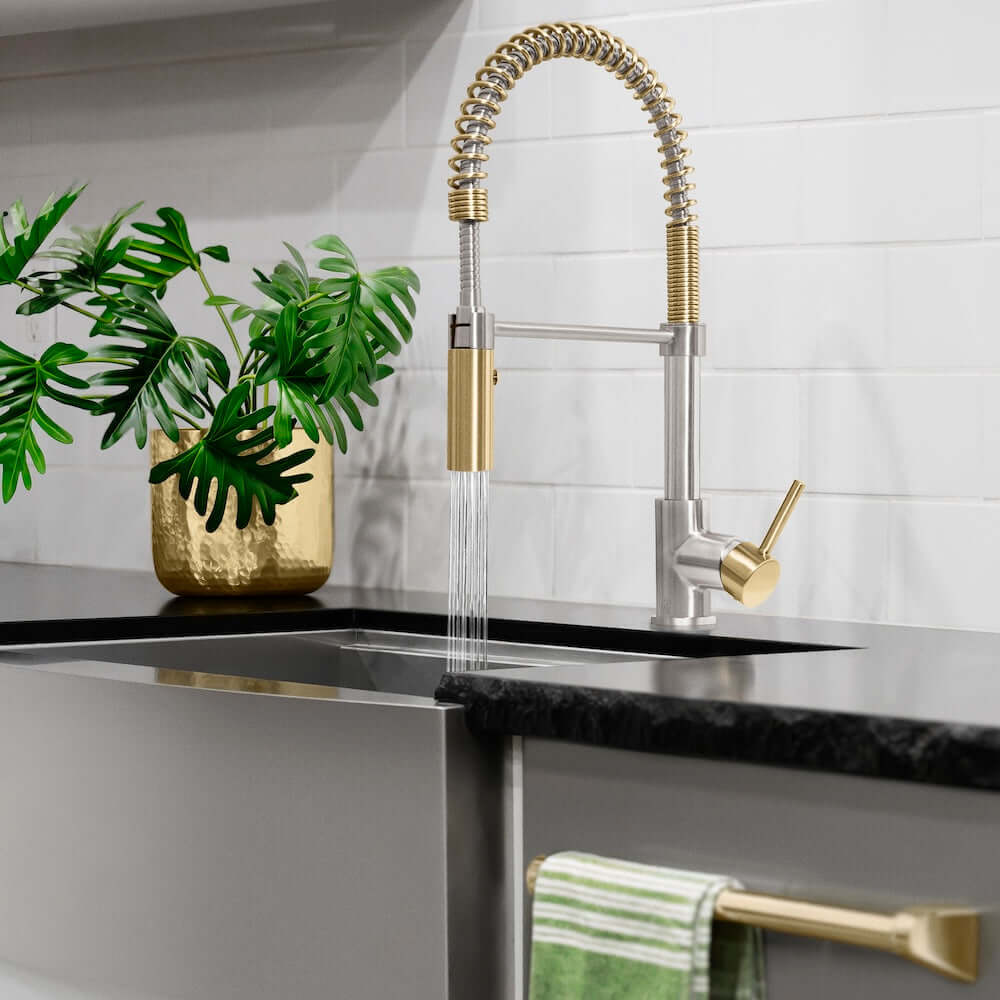 ZLINE Autograph Edition Sierra Pull Down Spring Single Handle Kitchen Faucet in Brushed Nickel and Champagne Bronze (SRA-KF-ZBNCB) lifestyle, water on.